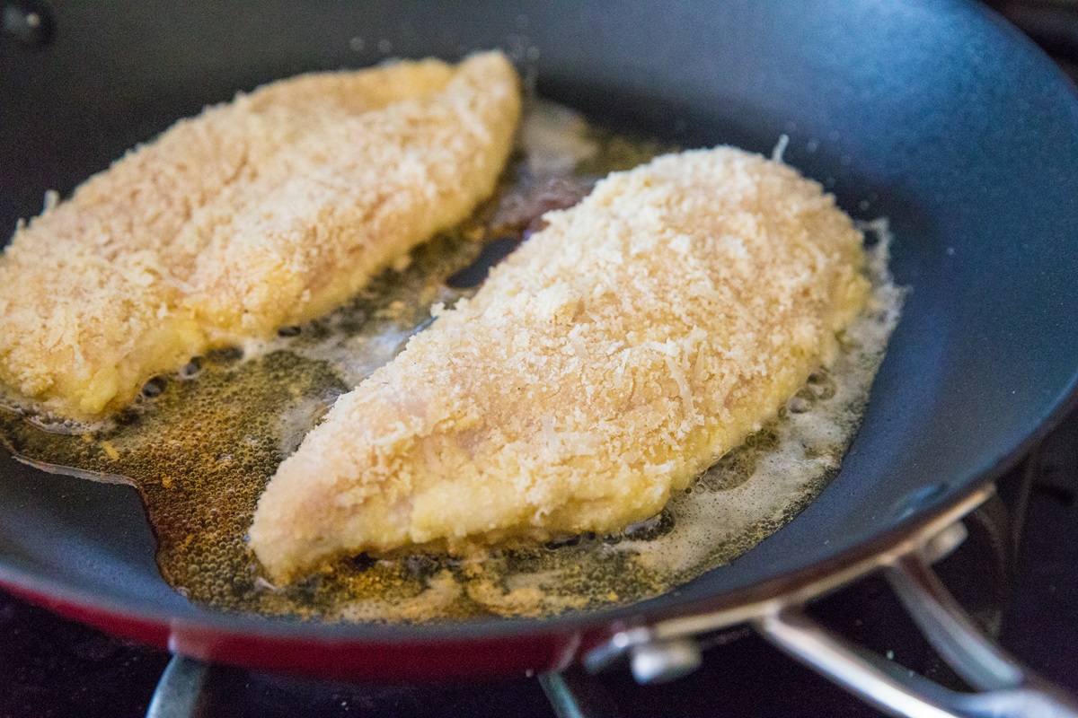 Pan frying breaded chicken for chicken parmesan