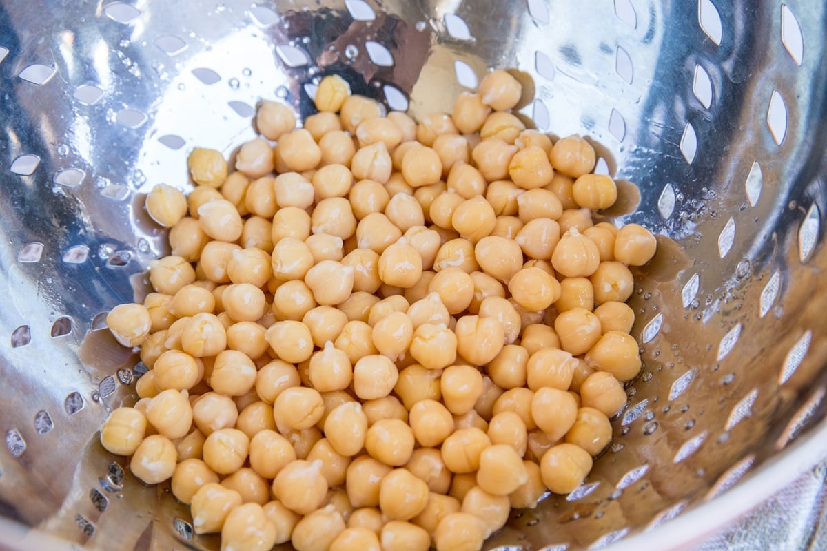 chickpeas in a colander, ready to be used in brownies.