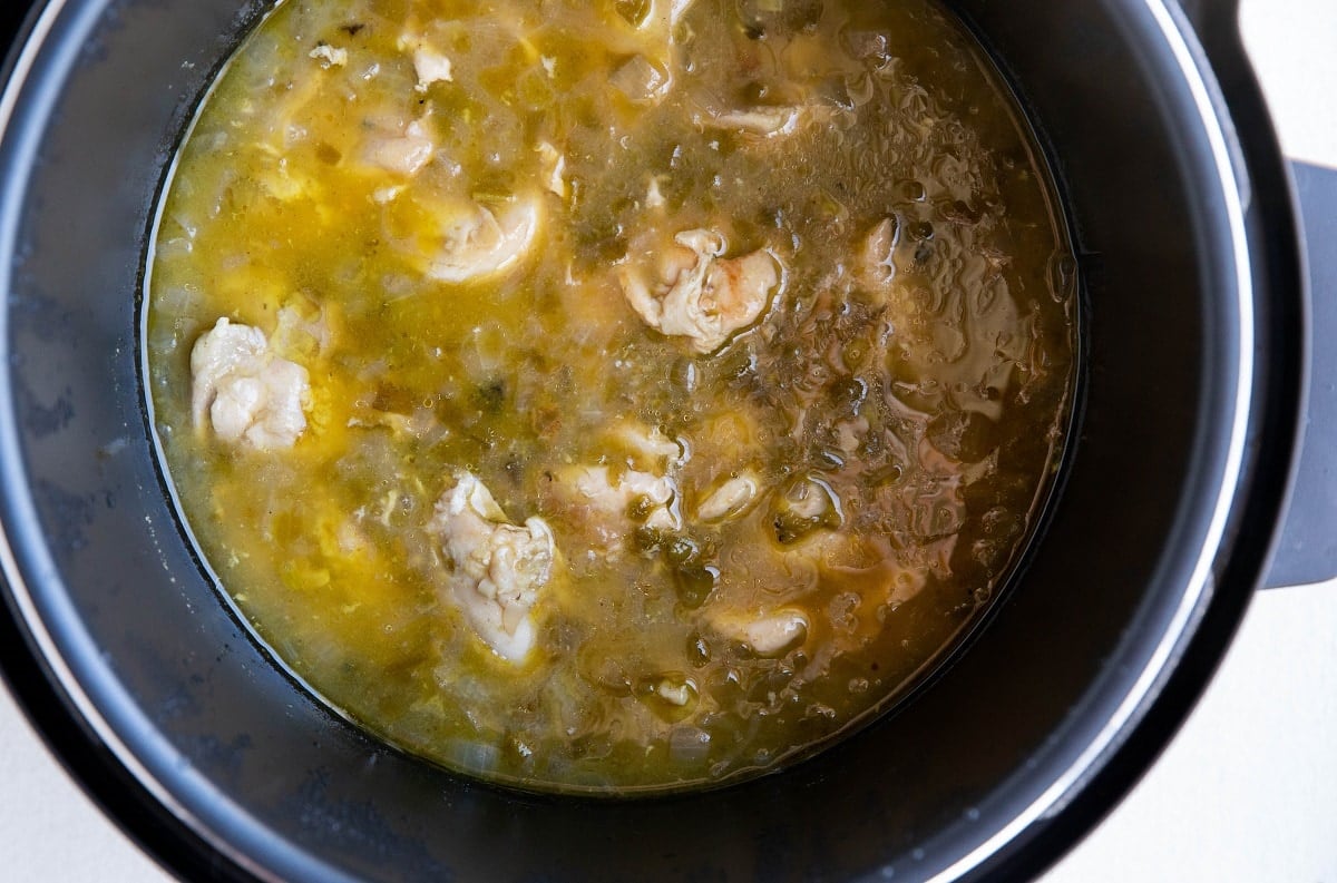 Chile verde chicken in an Instant Pot, ready to shred.