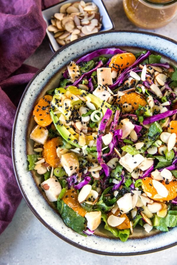 Large salad bowl full of Chinese chicken salad with a delicious sesame dressing.