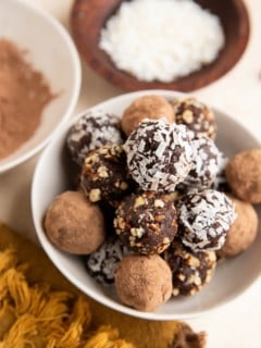 Healthy chocolate truffles in a white bowl, ready to serve.
