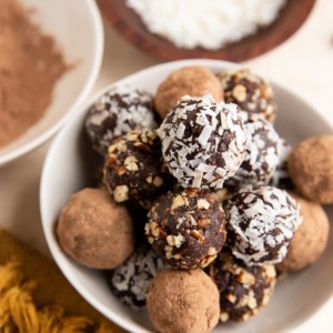 Healthy chocolate truffles in a white bowl, ready to serve.