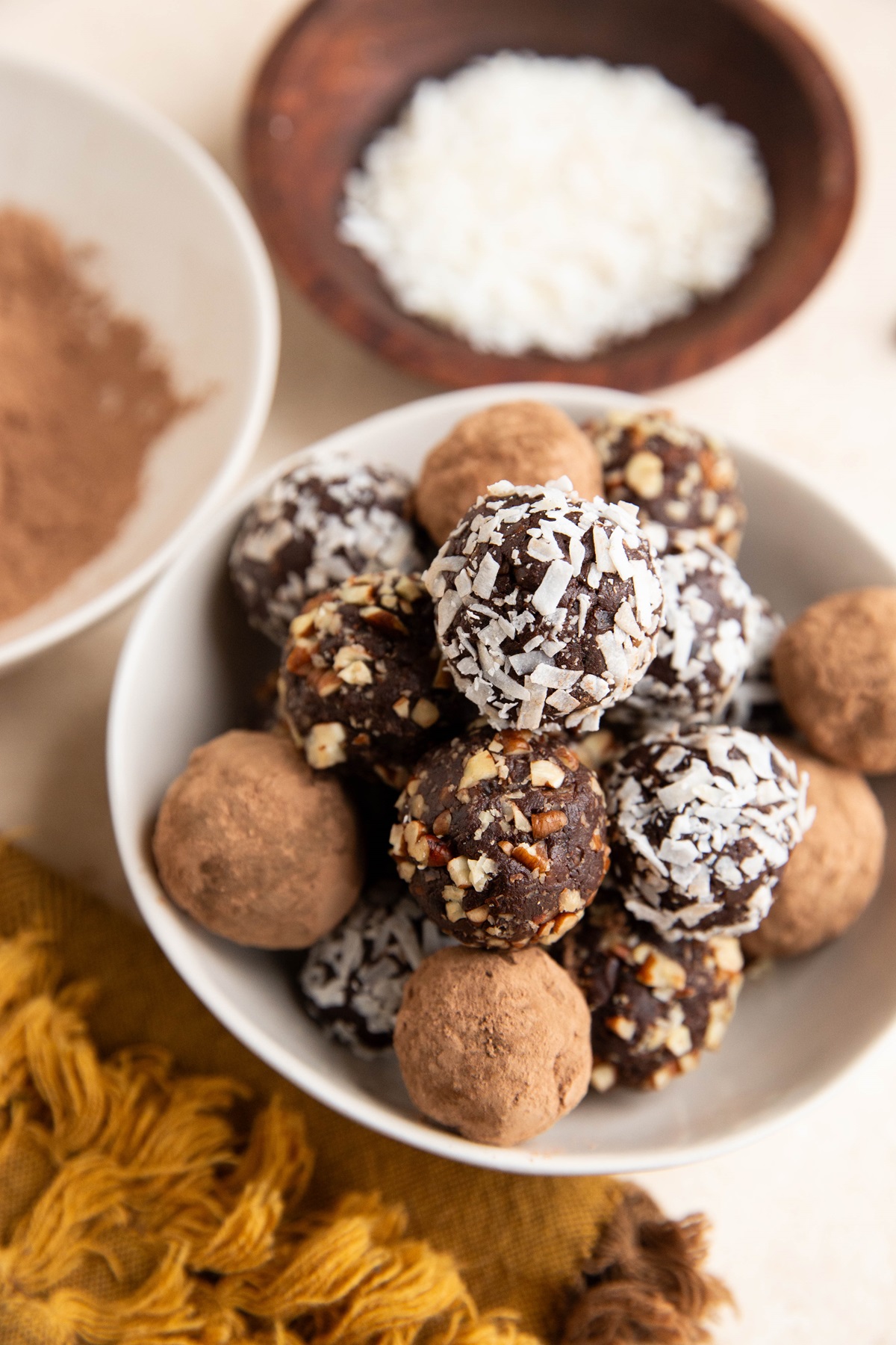 Healthy chocolate truffles in a white bowl, ready to serve.