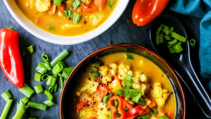 Two bowls of coconut curry soup.
