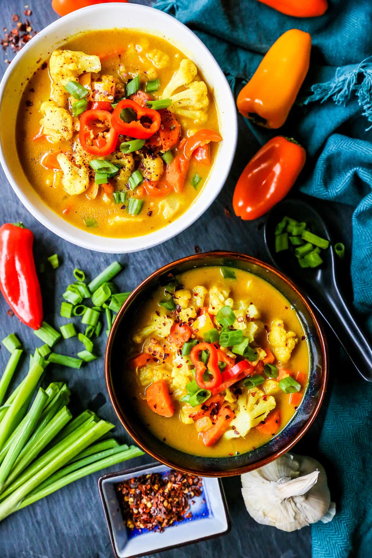 Two bowls of coconut curry soup.