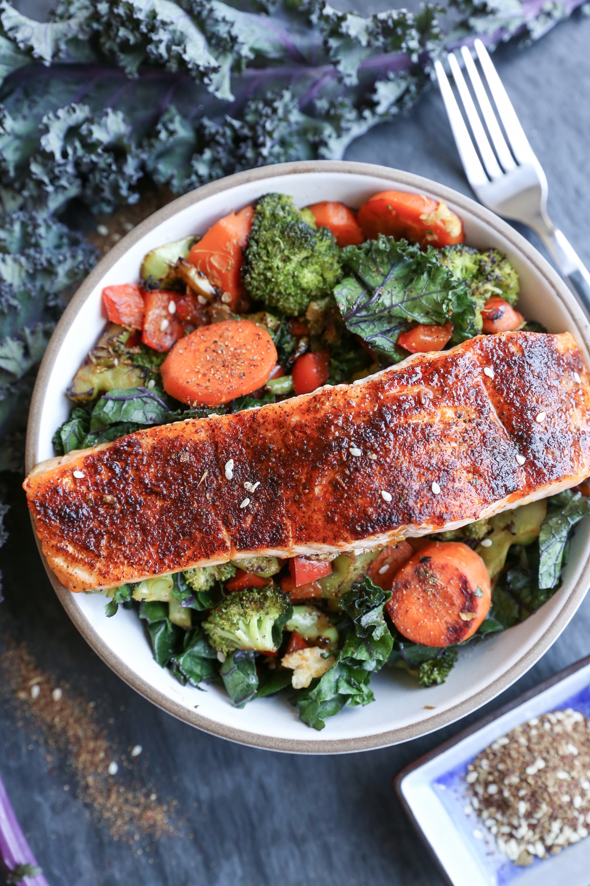 Bowl full of crispy salmon and vegetables.