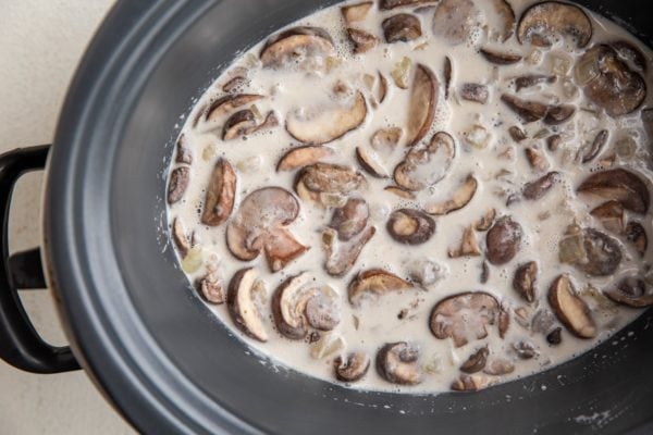Creamy mushroom sauce in a crock pot.