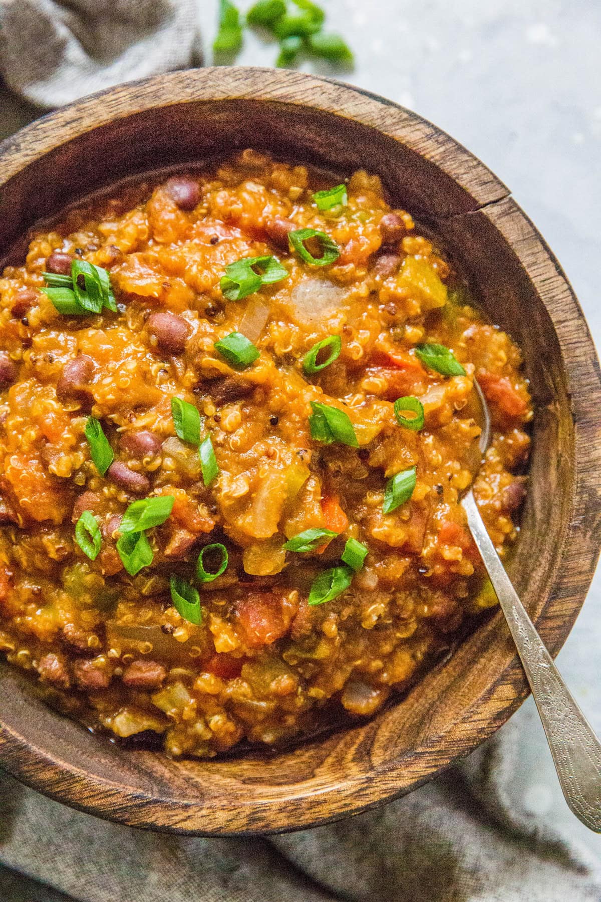 Slow cooker vegan pumpkin chili in a wooden bowl.