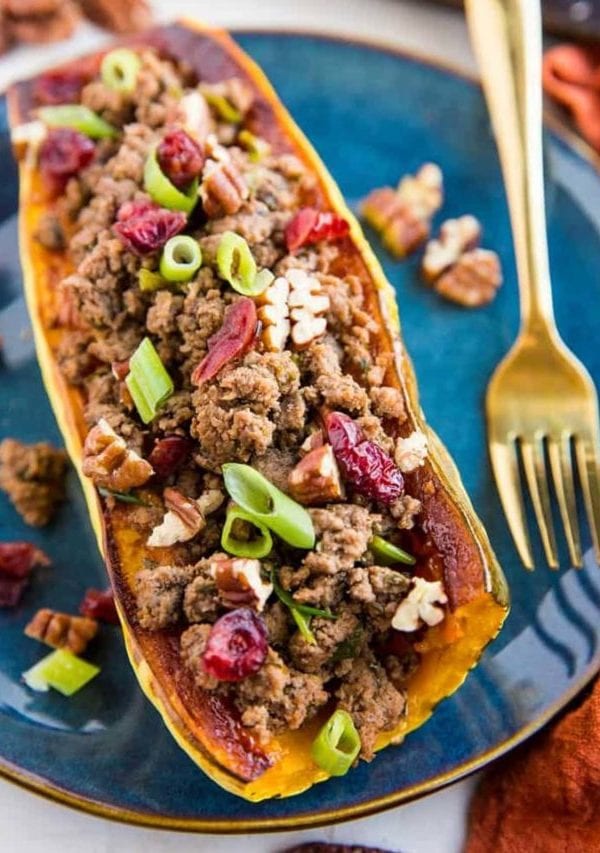 Stuffed Delicata Squash with Ground Beef, Cranberries and Pecans is a healthy dinner recipe that is paleo, whole30 and nutritious. Plus, it's easy to make!