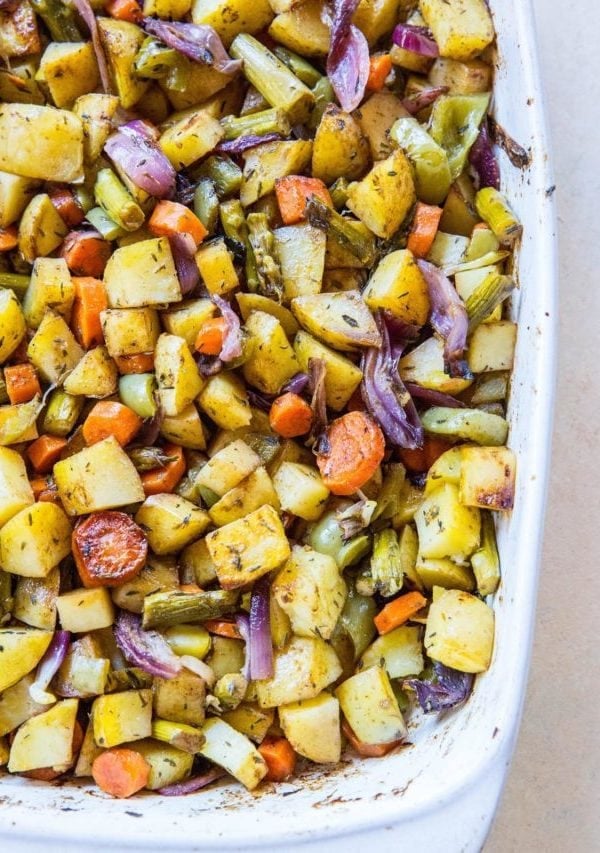 Balsamic roasted vegetables in a white casserole dish, fresh out of the oven and ready to serve.