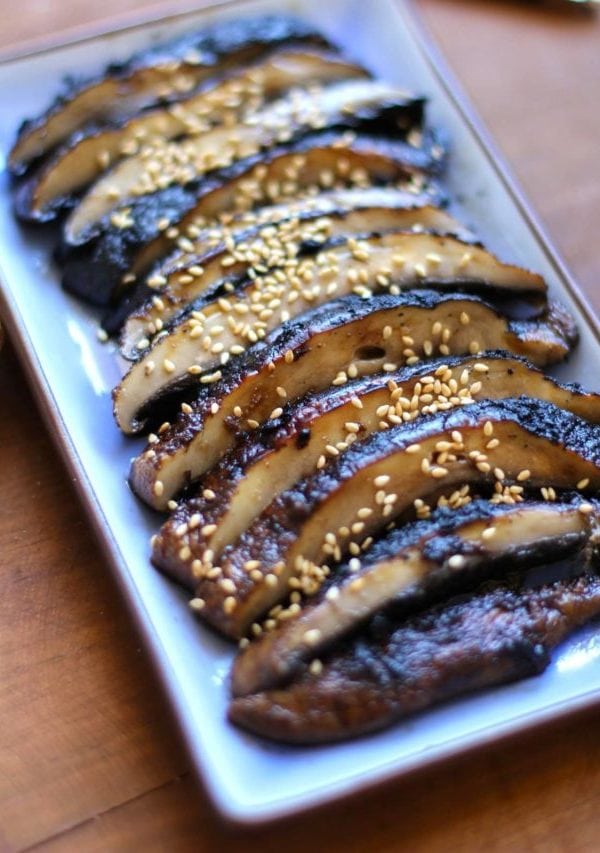 Plate of sliced grilled portobello mushrooms.