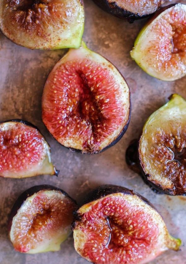 Roasted figs on a baking sheet fresh out of the oven and juicy.