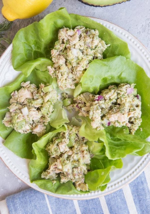 Tuna Lettuce Wraps on a white plate with a blue stripe napkin to the side. Ready to eat.