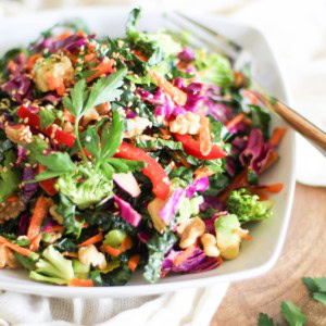The Ultimate Detox Salad with Lemon-Parsley Dressing in a white bowl, ready to eat.
