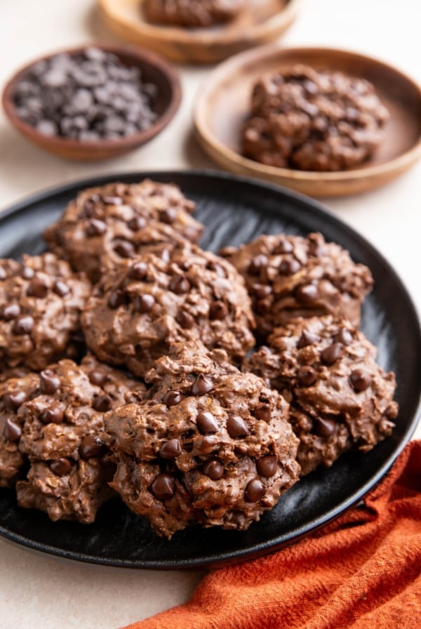 Black plate of double chocolate peanut butter cookies.