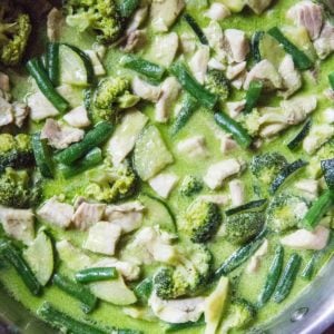 stainless steel skillet of fish green curry ready to serve.