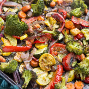 Garlic Herb Roasted Vegetables on a large rimmed sheet pan, fresh out of the oven.