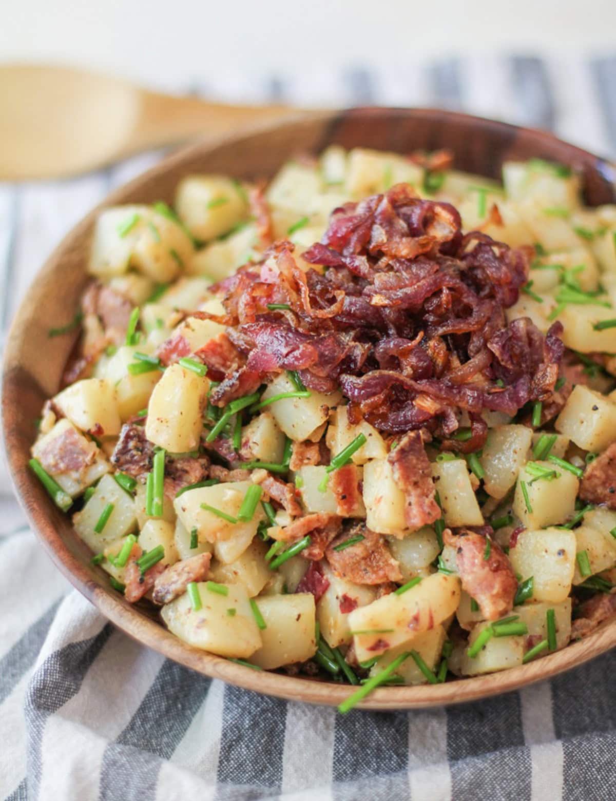 German-Style Potato Salad with bacon, caramelized onions, and chives | TheRoastedRoot.net #sidedish #recipe #picnic #bbq #summer #4thofjuly