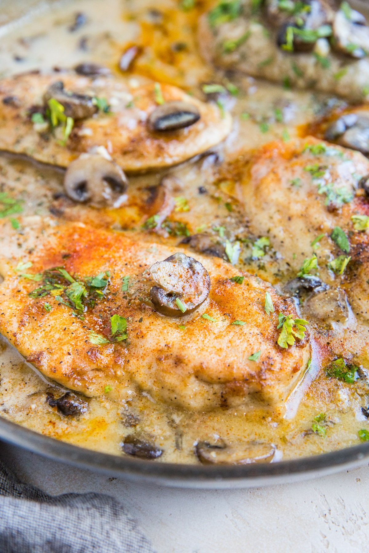 Chicken Marsala in a skillet with creamy mushroom sauce, ready to serve.