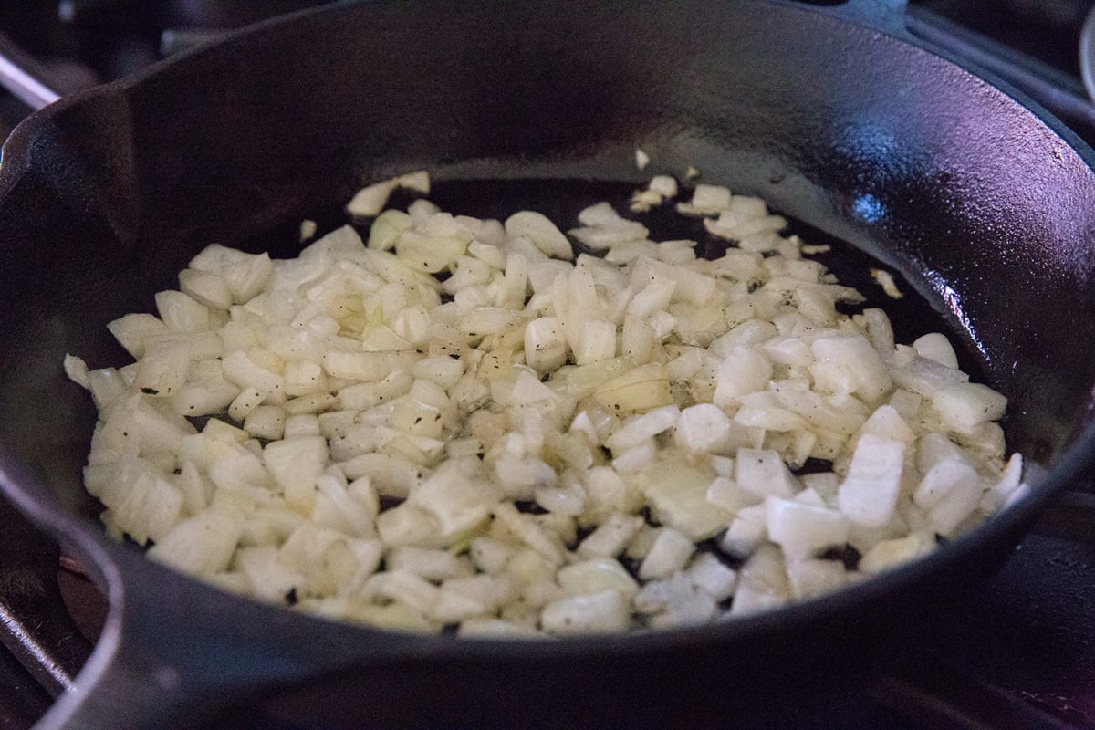 Onion cooking in a cast iron skillet.