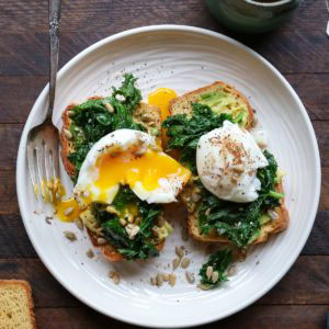 Avocado toast with kale and soft boiled egg on homemade gluten-free sandwich bread