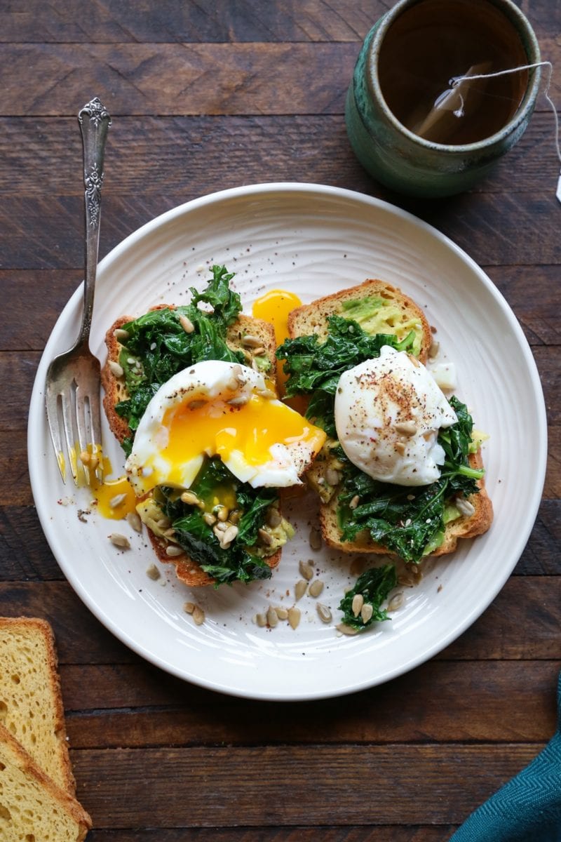Avocado toast with kale and soft boiled egg on homemade gluten-free sandwich bread
