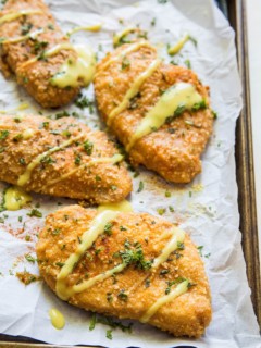 Grain-Free Pretzel-Crusted Baked Chicken - a healthier take on crispy chicken on a baking sheet fresh out of the oven.