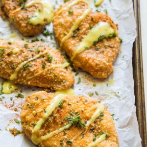 Grain-Free Pretzel-Crusted Baked Chicken - a healthier take on crispy chicken on a baking sheet fresh out of the oven.