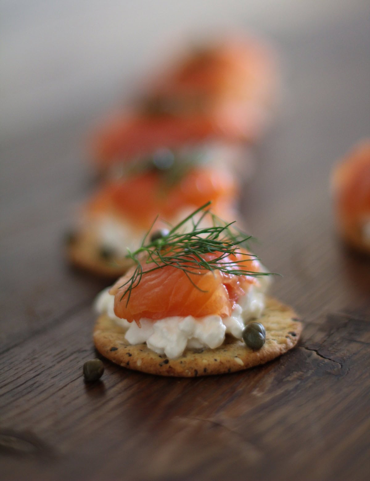 Swedish Gravlax on crackers with cottage cheese, capers and fresh dill