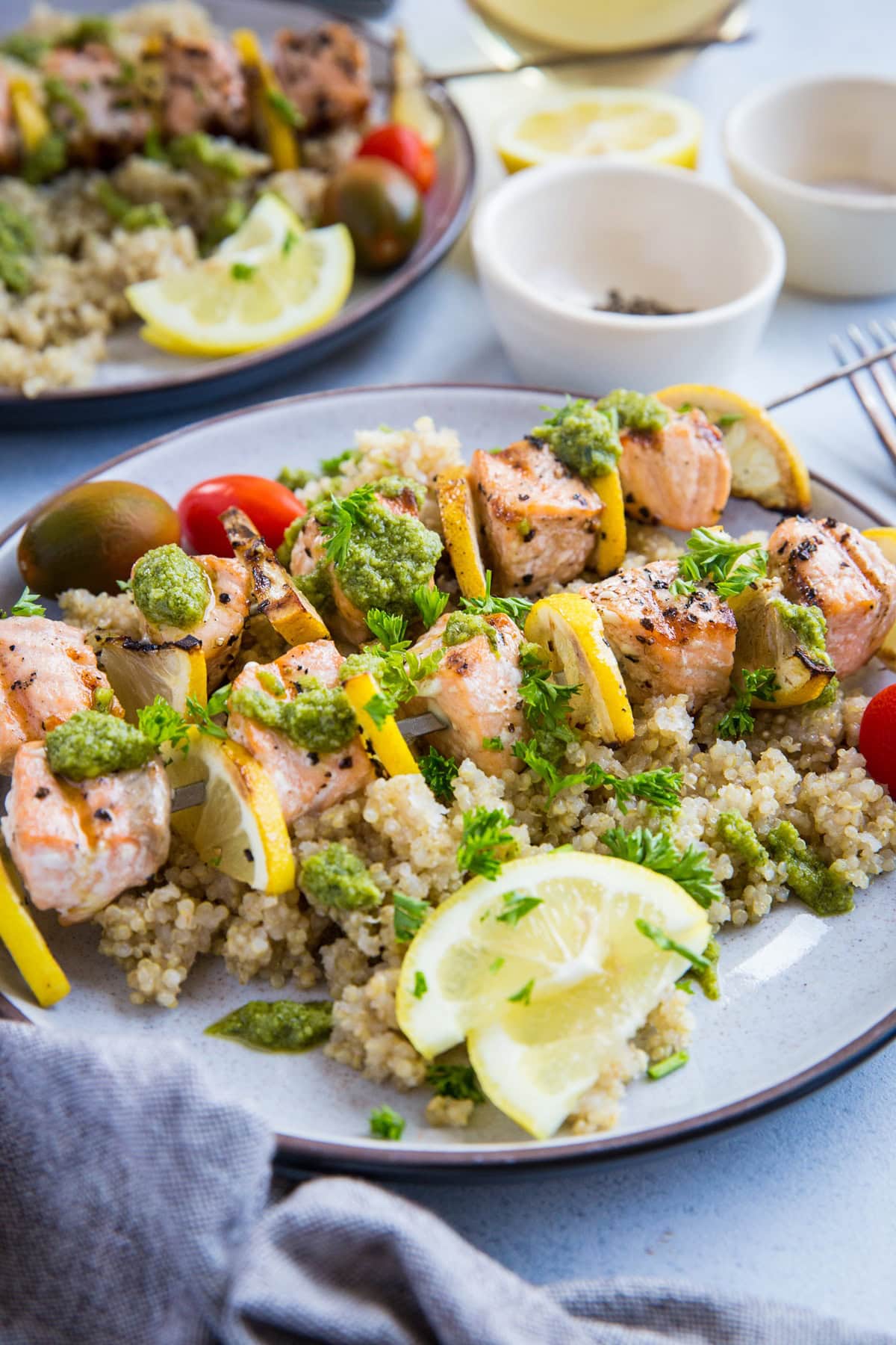 Quick and Easy Grilled Salmon Kabobs with pesto sauce and quinoa - a deliciously healthy clean meal | TheRoastedRoot.net #glutenfree #paleo #primal