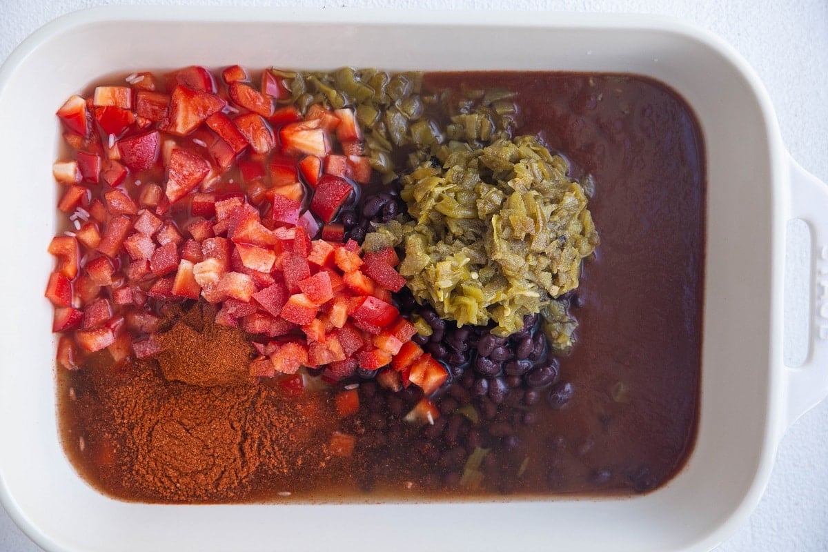 black beans, vegetables, broth and salsa in a large casserole dish to make a casserole