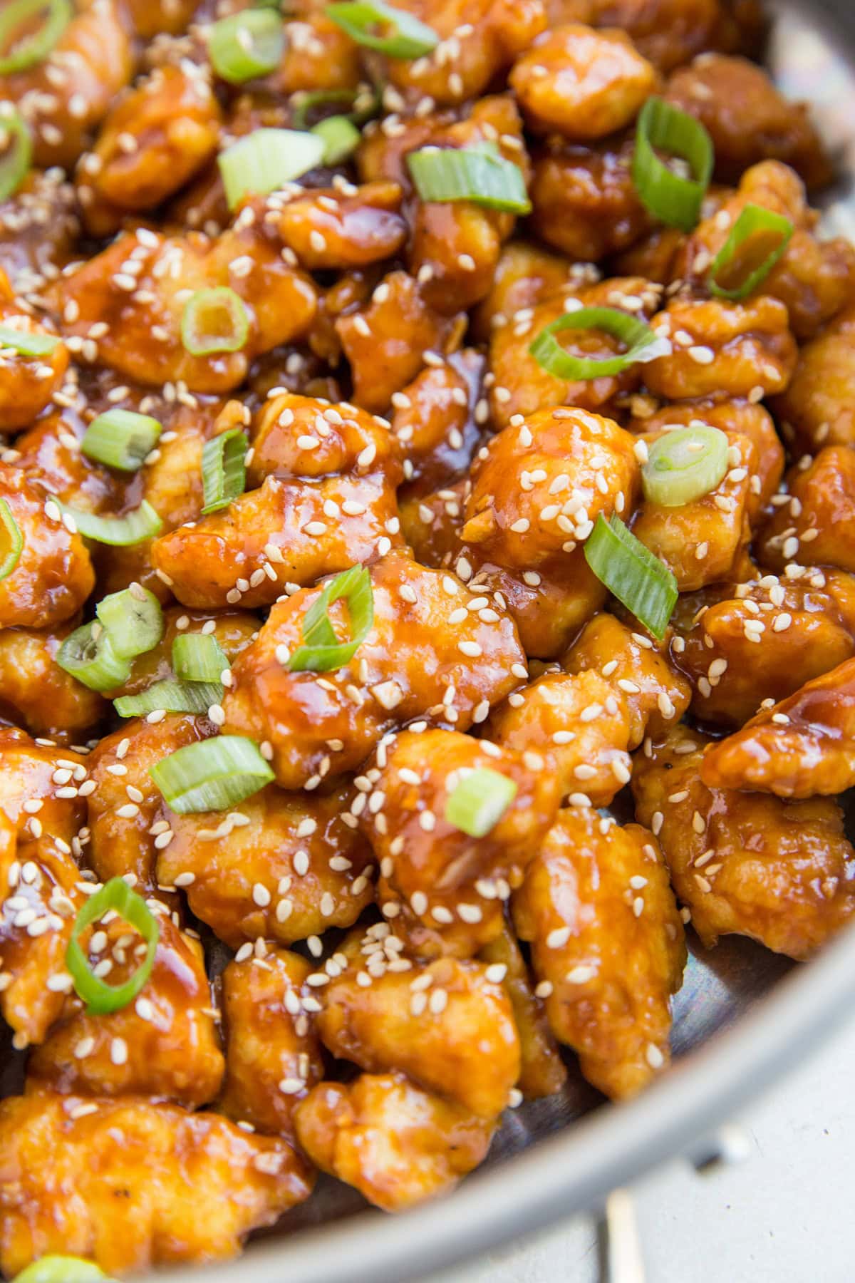 Skillet full of finished general chicken.