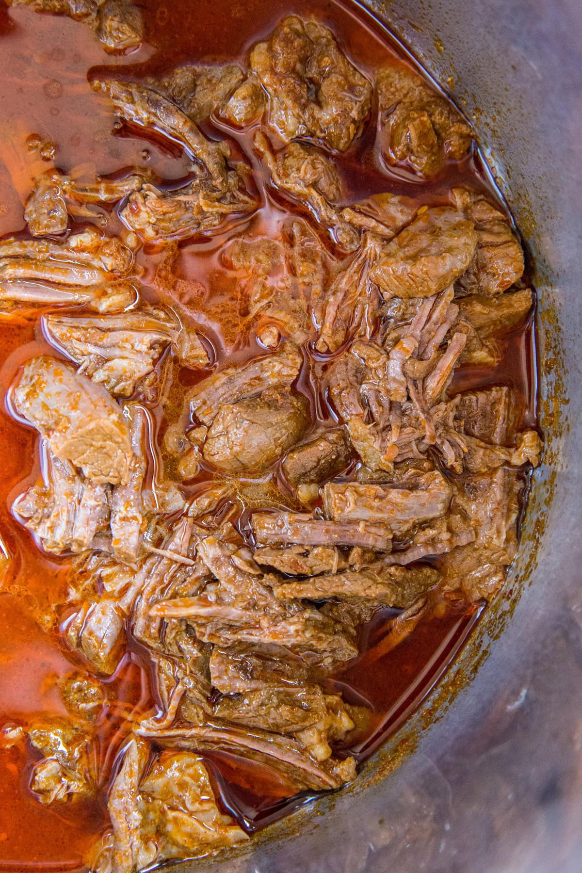 Instant Pot full of shredded barbacoa beef, ready to serve.