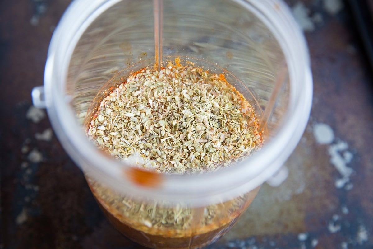 adobo sauce ingredients for barbacoa beef in a small blender, waiting to be blended.
