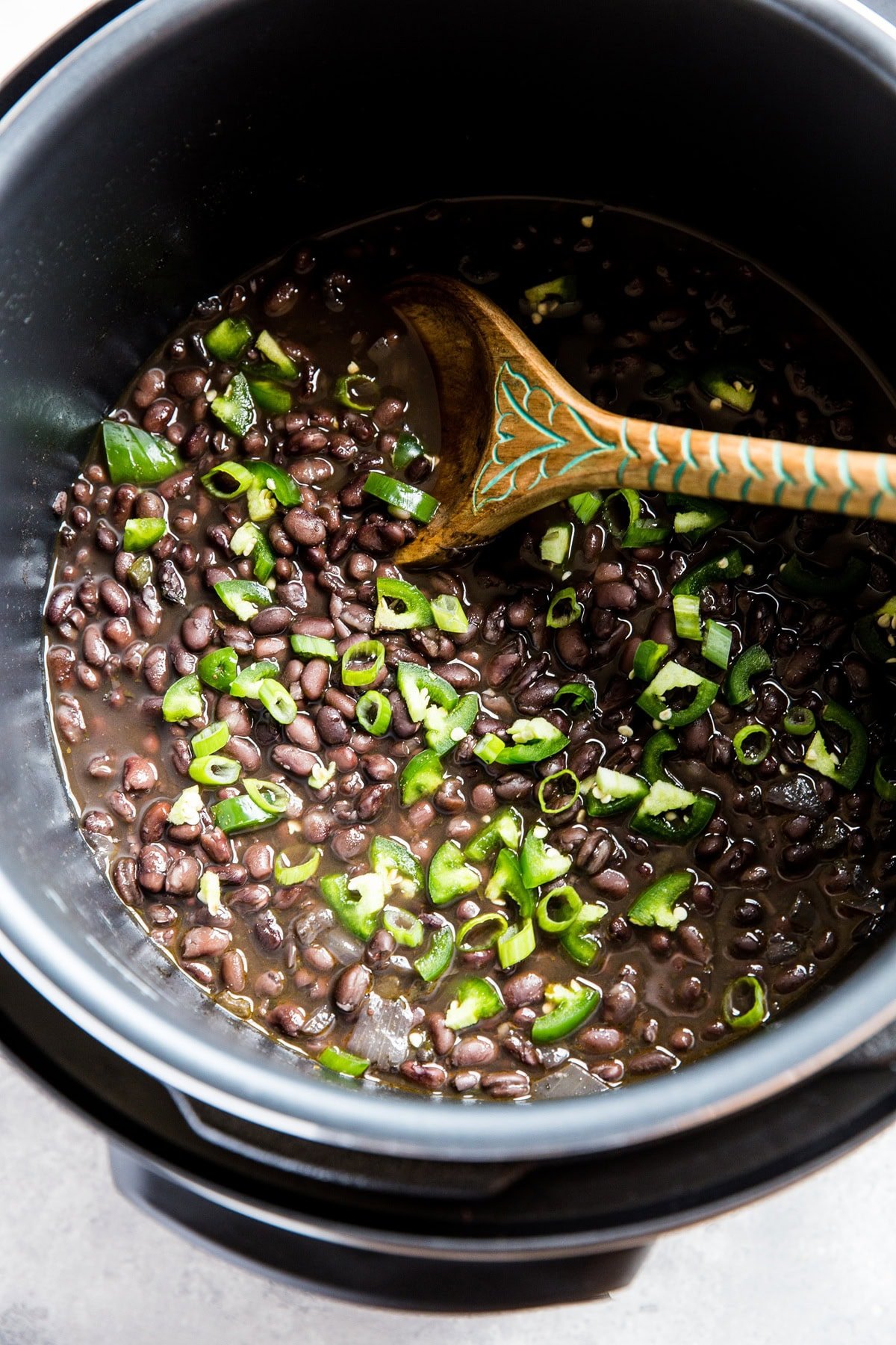 Instant pot full of cooked black beans.