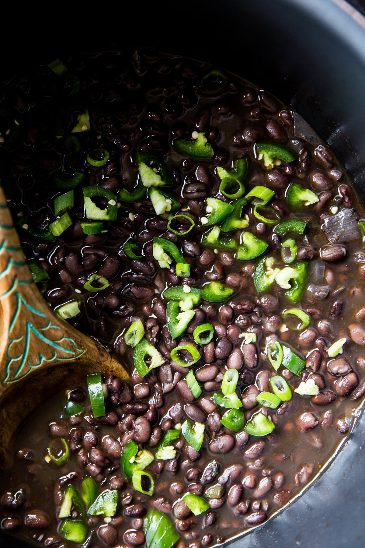pressure cooker full of black beans, ready to eat.