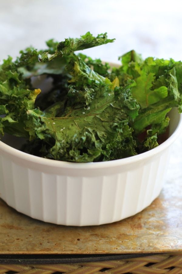 Baked Kale Chips in a ramekin, ready to serve.