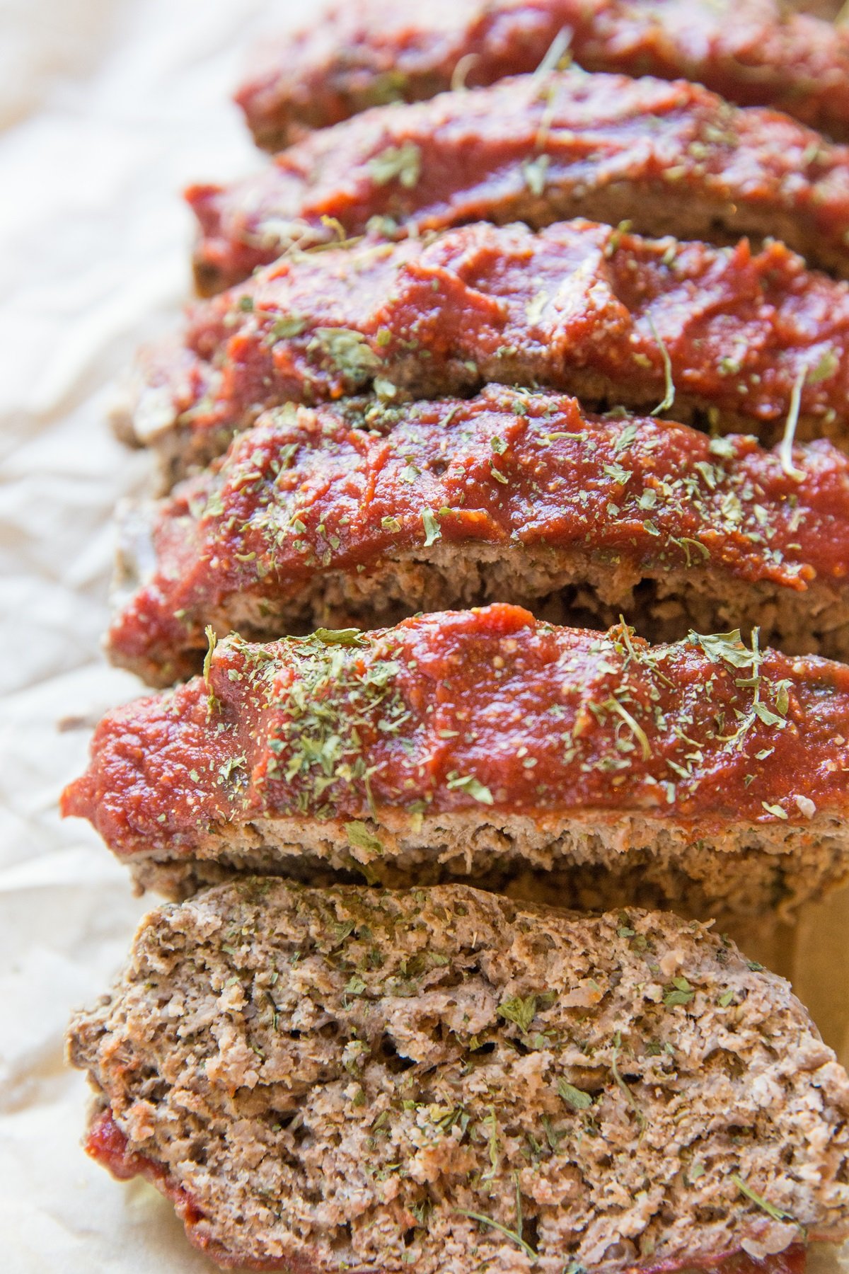 Grain-free meatloaf sliced into individual slices, ready to serve.