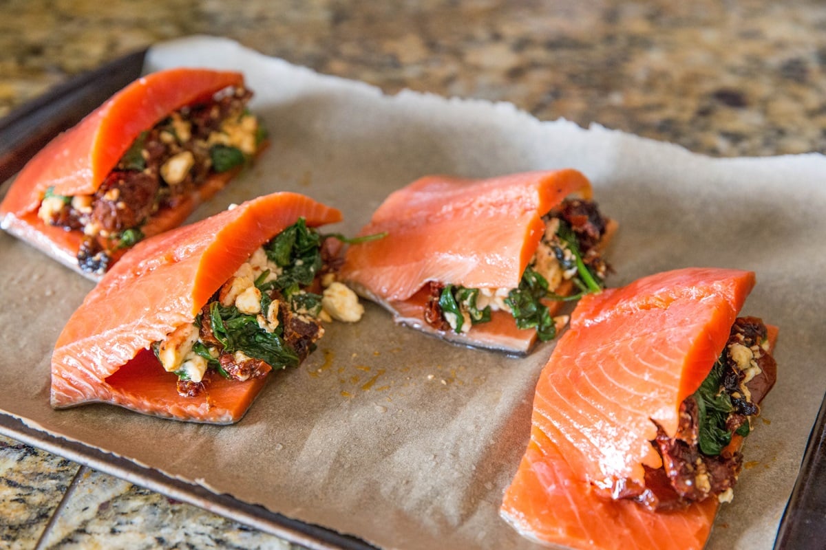 Salmon stuffed with sun-dried tomatoes, feta, and spinach