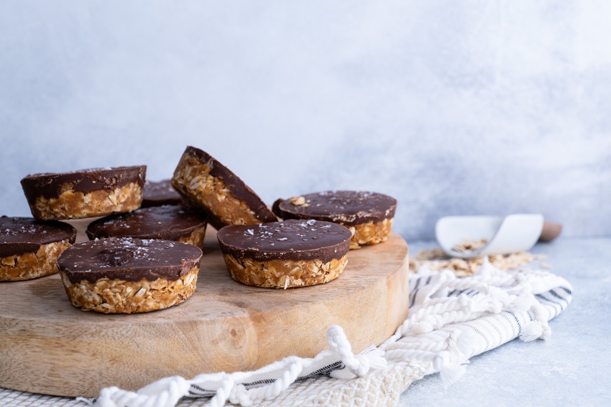 Peanut butter cups on a white plate, ready to eat.