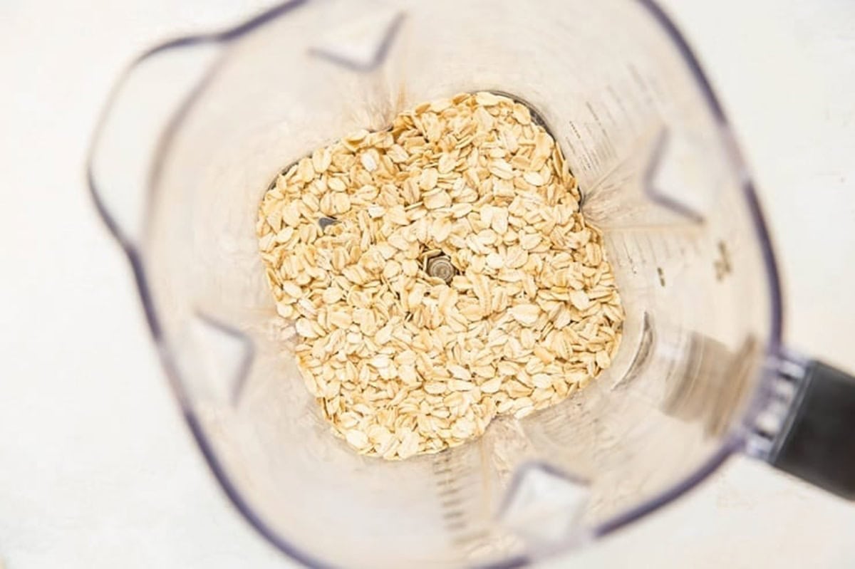 Oats in a blender, ready to be blended into a flour to make pancakes.