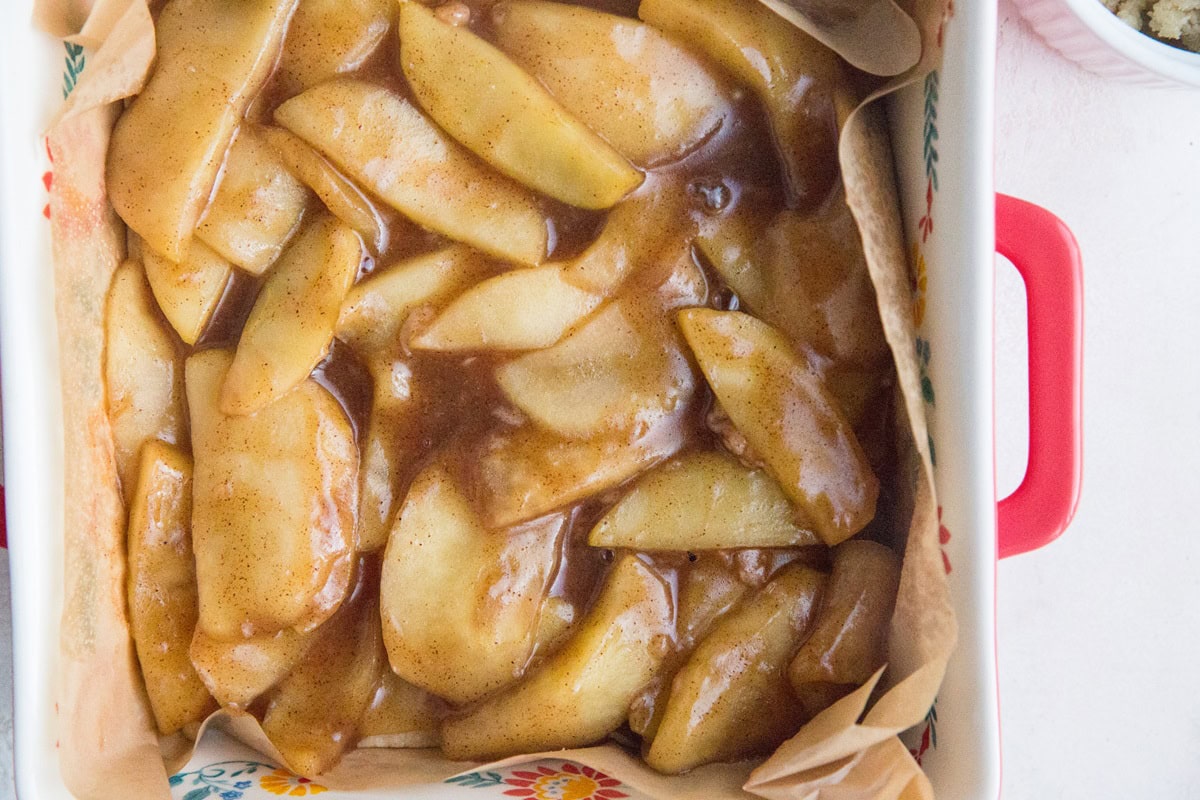 Layer the cooked apples on top of the crust