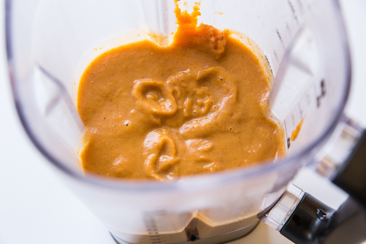 Pumpkin pie filling ingredients blended in a blender