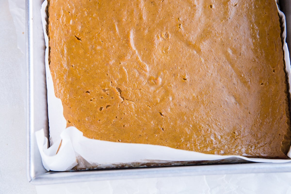 Paleo Pumpkin Pie Bars fresh out of the oven in a baking pan.