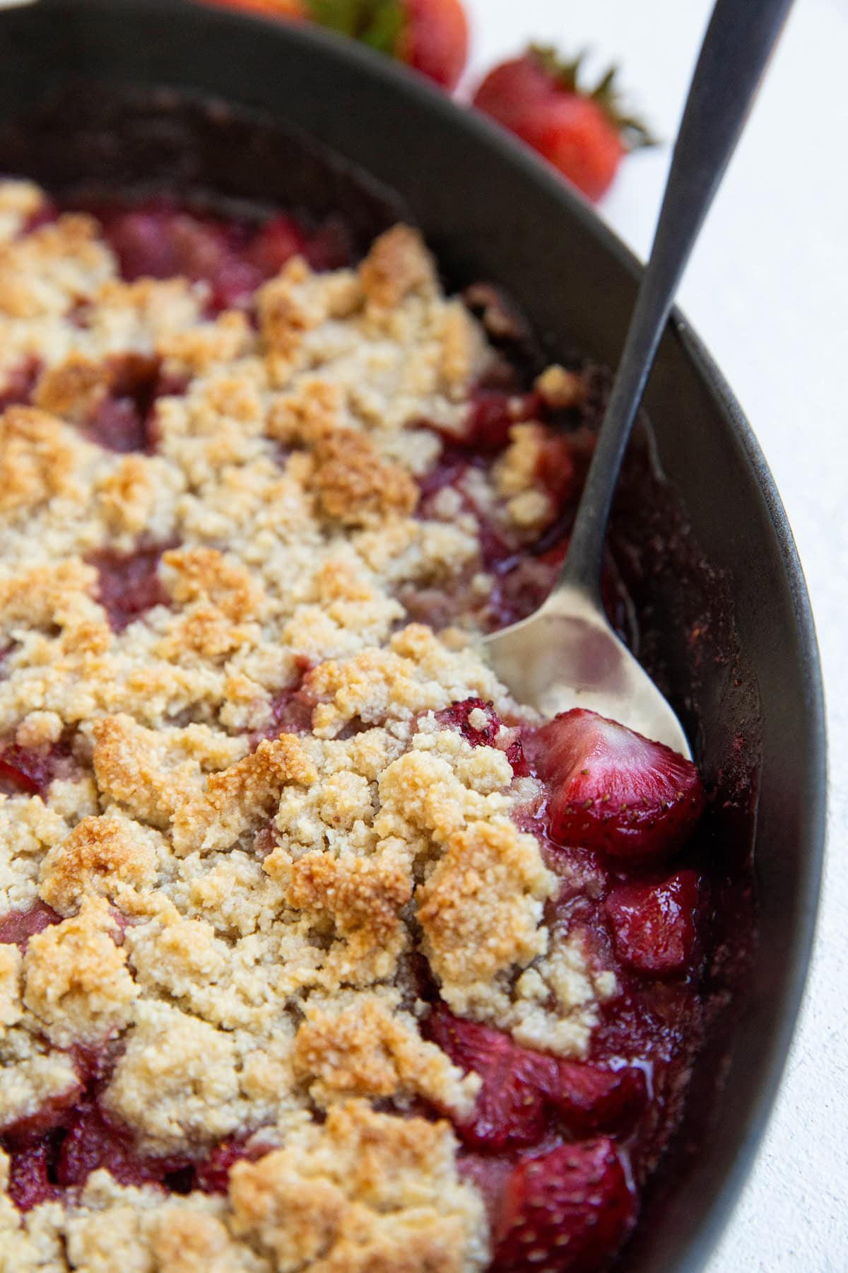 Casserole dish of strawberry crumble, fresh out of the oven.