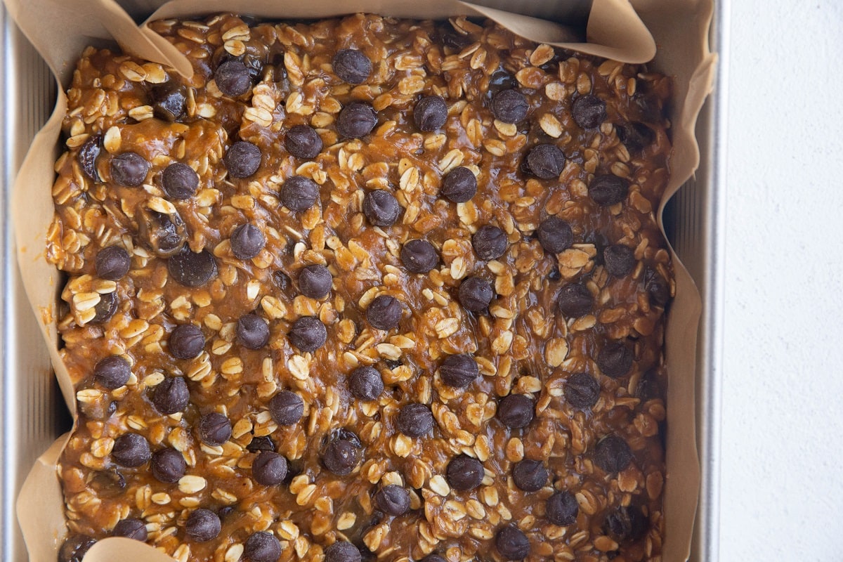 Oatmeal peanut butter cookie dough in a baking pan.