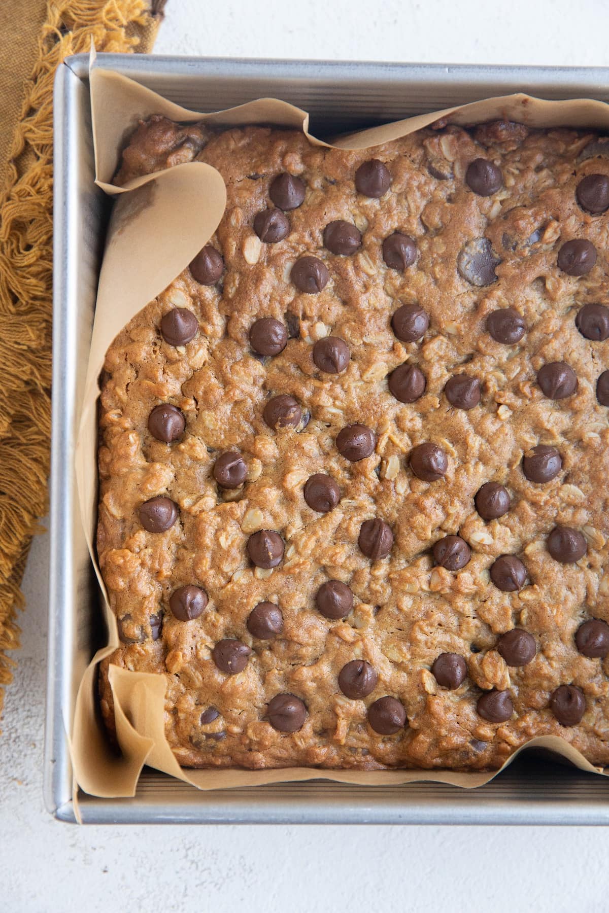 Peanut Butter Oatmeal Chocolate Chip Cookie Bars in a baking dish, fresh out of the oven.