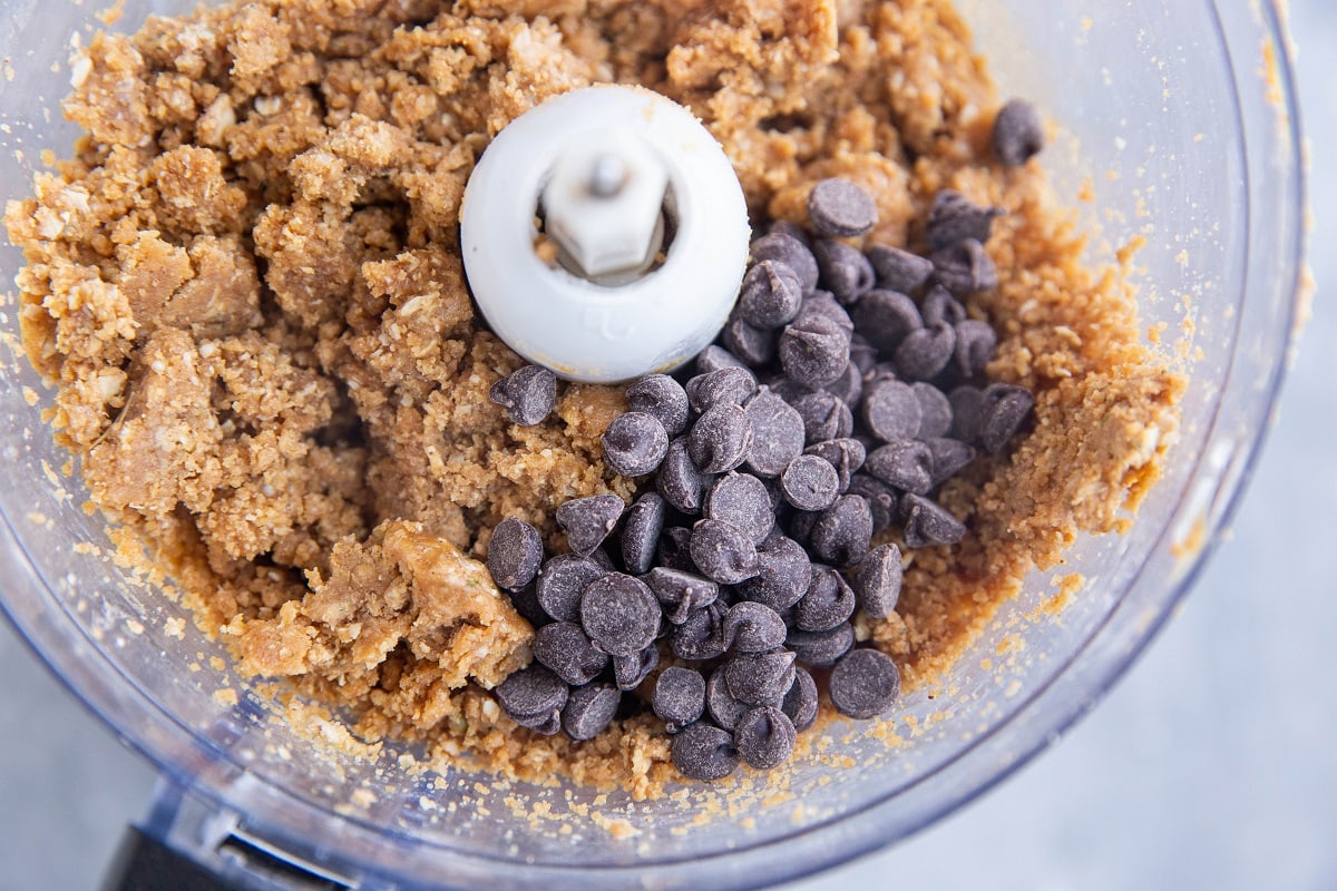 Chocolate chips on top of cookie dough mixture.