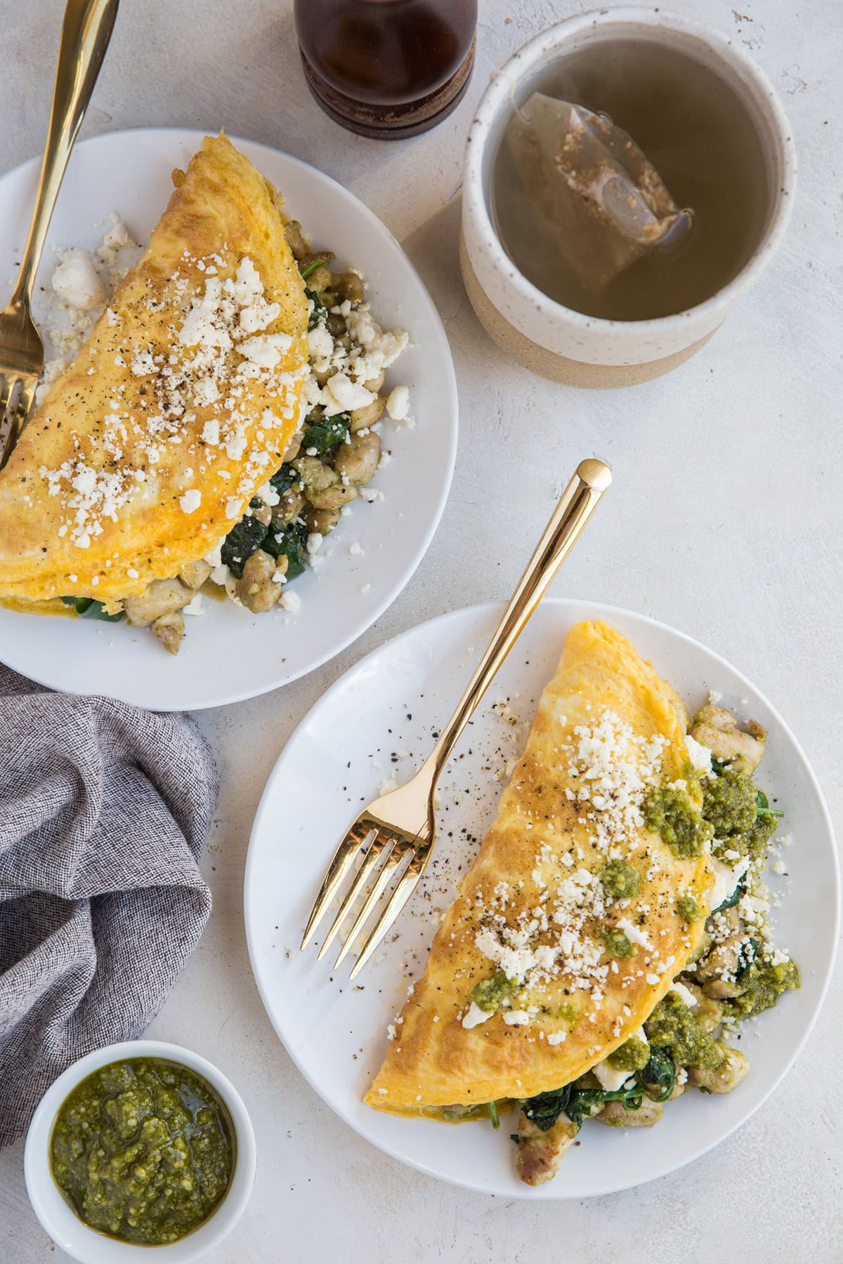 Pesto Chicken Omelettes with feta cheese and spinach are an amazing breakfast that's so easy to make