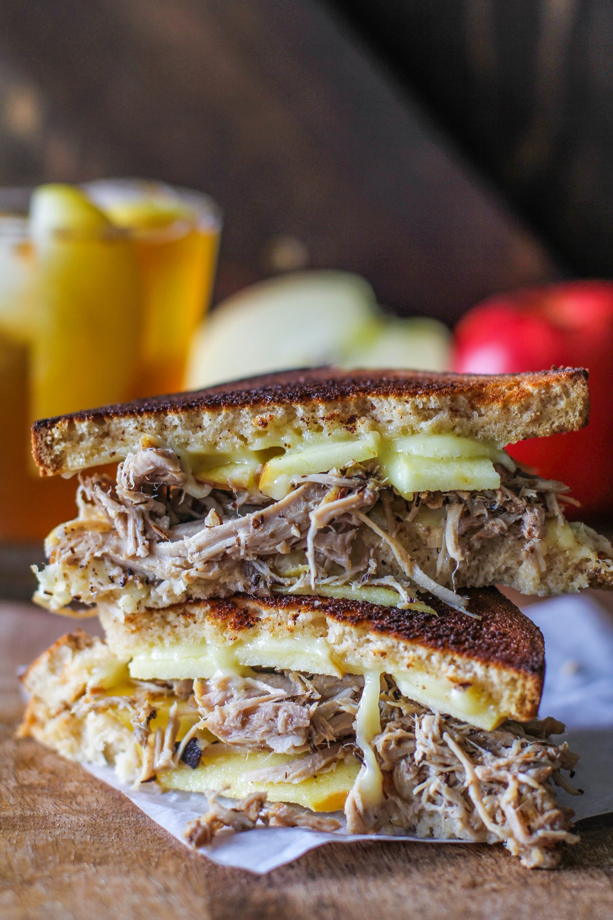 Pulled pork sandwich with gouda cheese and apples.